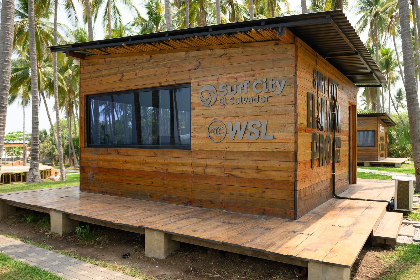 Surf City El Salvador pavilion surrounded by palm trees
